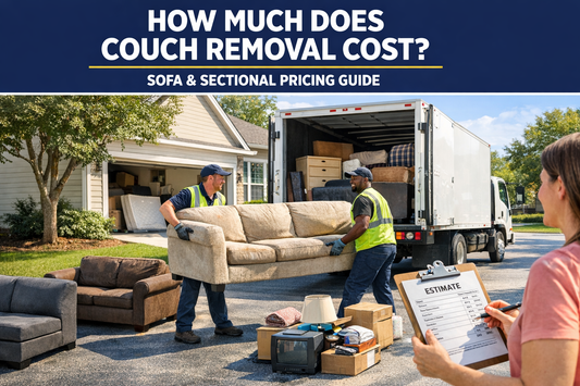 Junk removal crew carrying an old couch toward a truck in a suburban driveway with sectional sofa pieces nearby for a homeowner guide about couch removal cost and furniture disposal pricing.